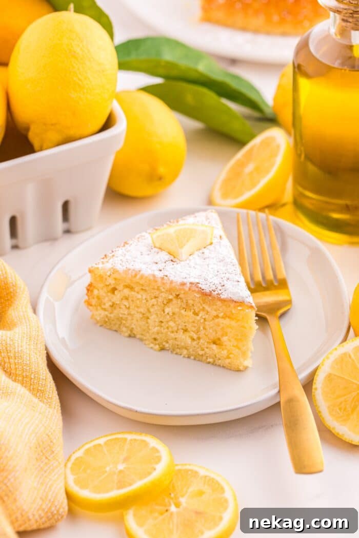 How to Bake Lemon Olive Oil Cake 4 Slice of lemon olive oil cake on a plate with a fork.