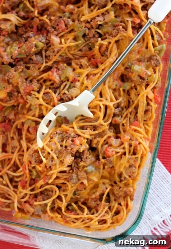 Close-up of Confetti Spaghetti showcasing the colorful vegetables and rich sauce.