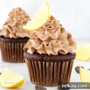 Close-up of a Double Chocolate Lemon Surprise Cupcake, revealing its rich chocolate cake and creamy frosting.