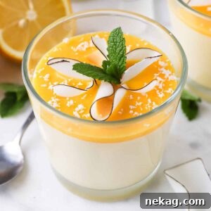 Individual servings of lemon mousse, elegantly topped with fresh mint leaves, ready to be enjoyed.
