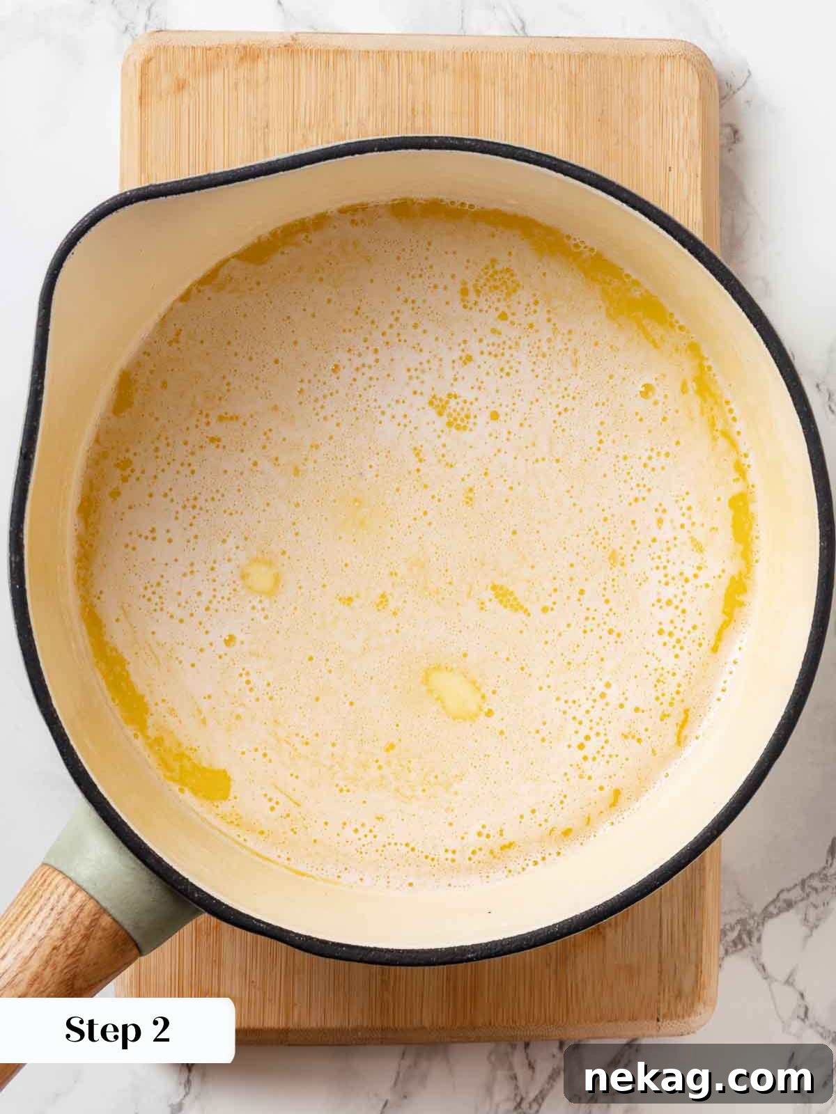 Rippled Golden Doughnuts 8 Unsalted butter cubes slowly melting into whole milk in a high-sided saucepan over medium heat, nearing a gentle boil.
