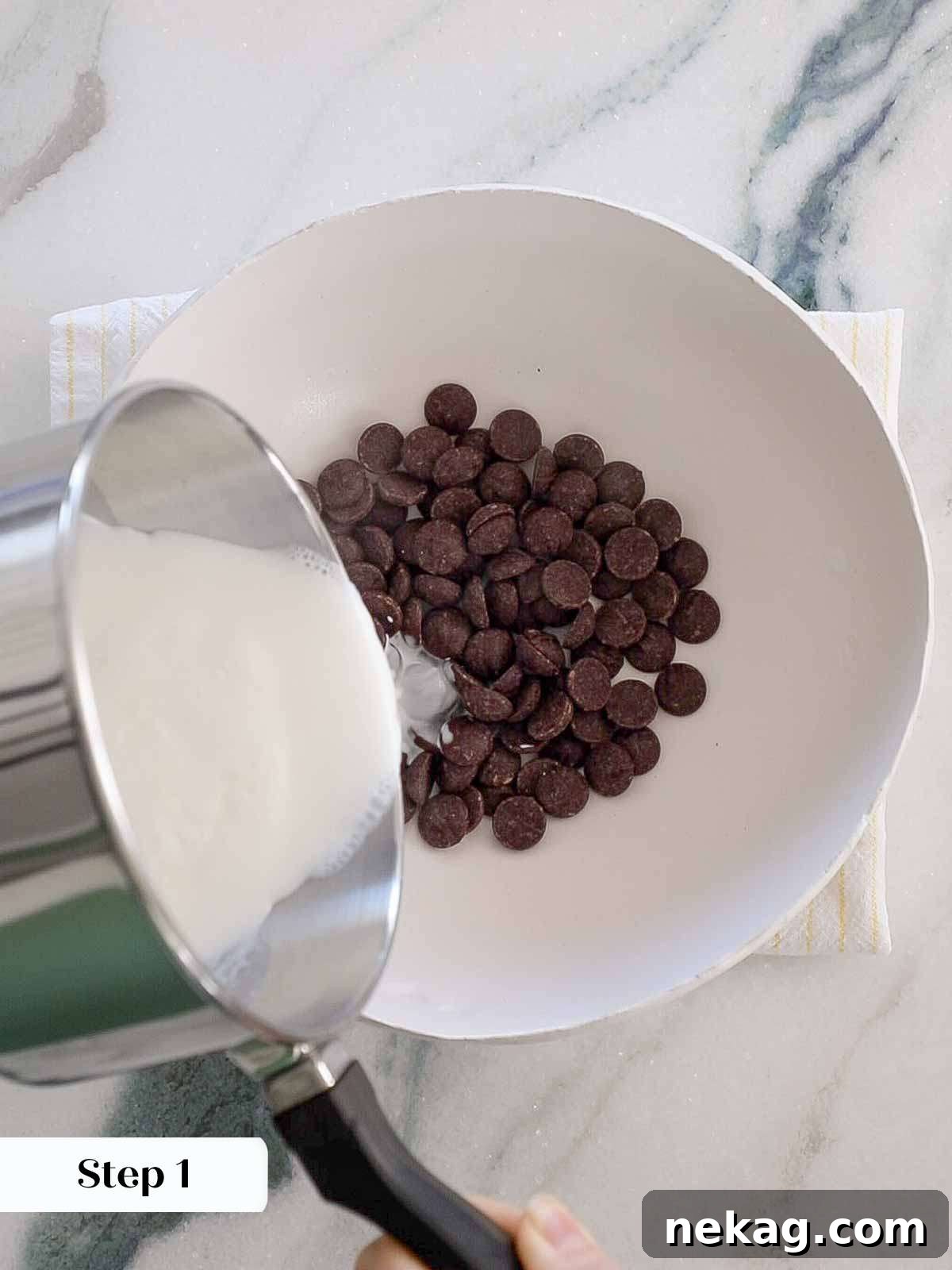 Mastering Chocolate Ganache 7 pouring boiling cream on chocolate.
