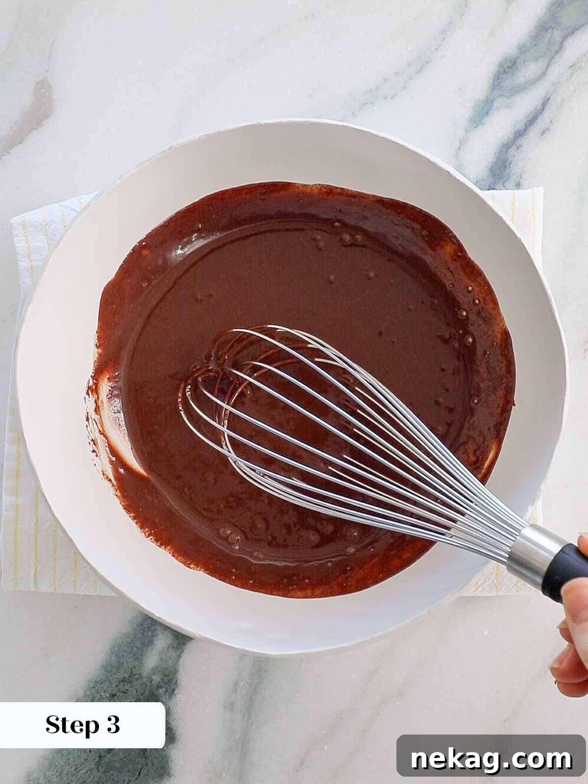 Mastering Chocolate Ganache 9 whisking ganache to emulsify.
