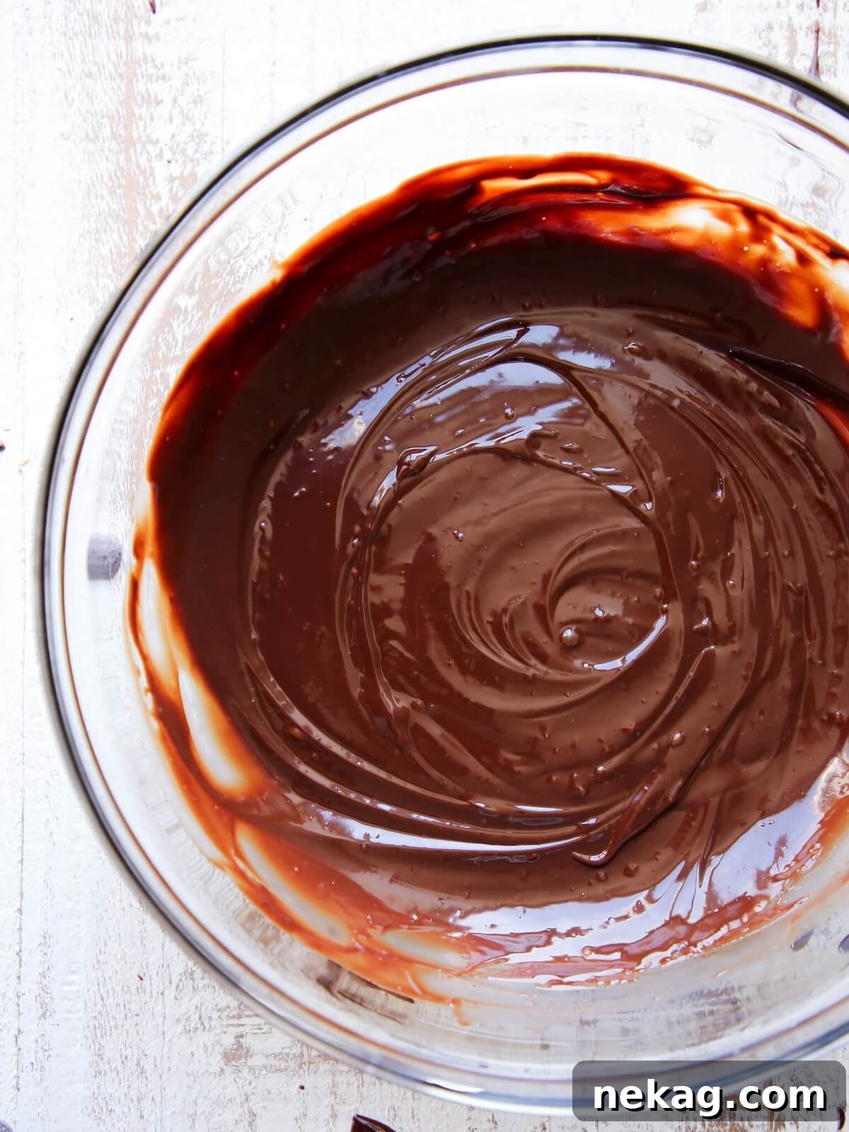 Mastering Chocolate Ganache 10 shiny ganache in clear bowl.
