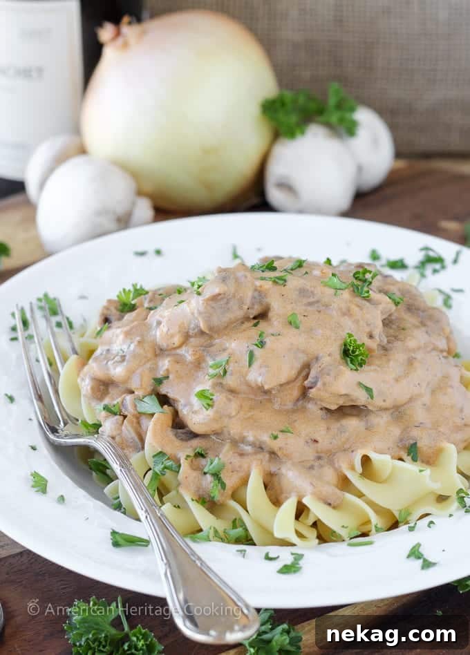 This Healthy Beef Stroganoff has all of the familiar flavor with none of the guilt! A close up of the creamy sauce and tender beef.