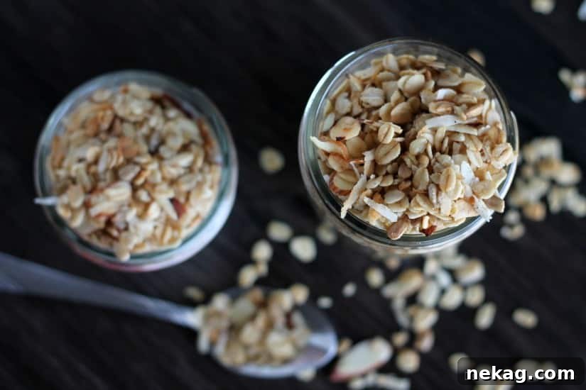 Close-up of baked Honey Almond Coconut Granola showing oats, almonds, and flakes