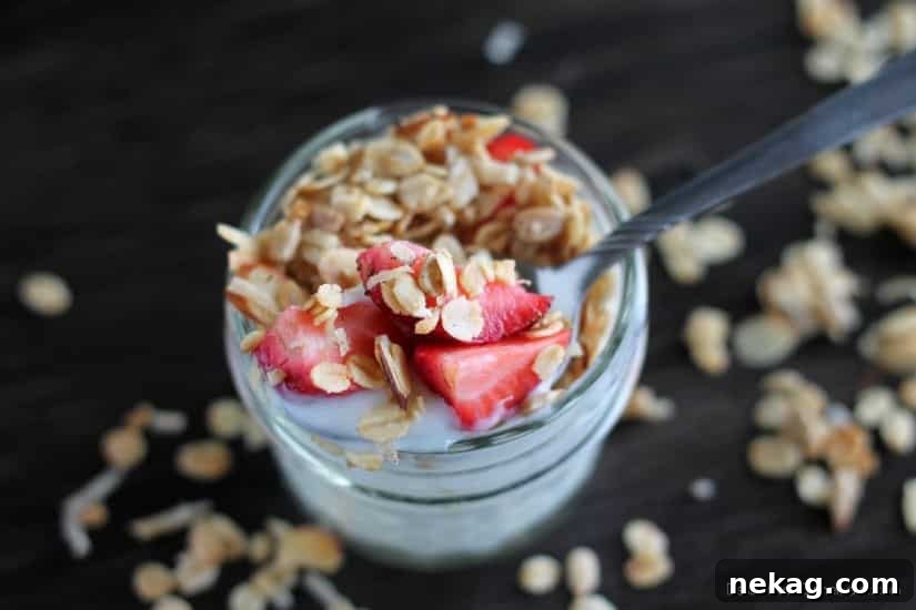 Serving of Honey Almond Coconut Granola with yogurt and berries