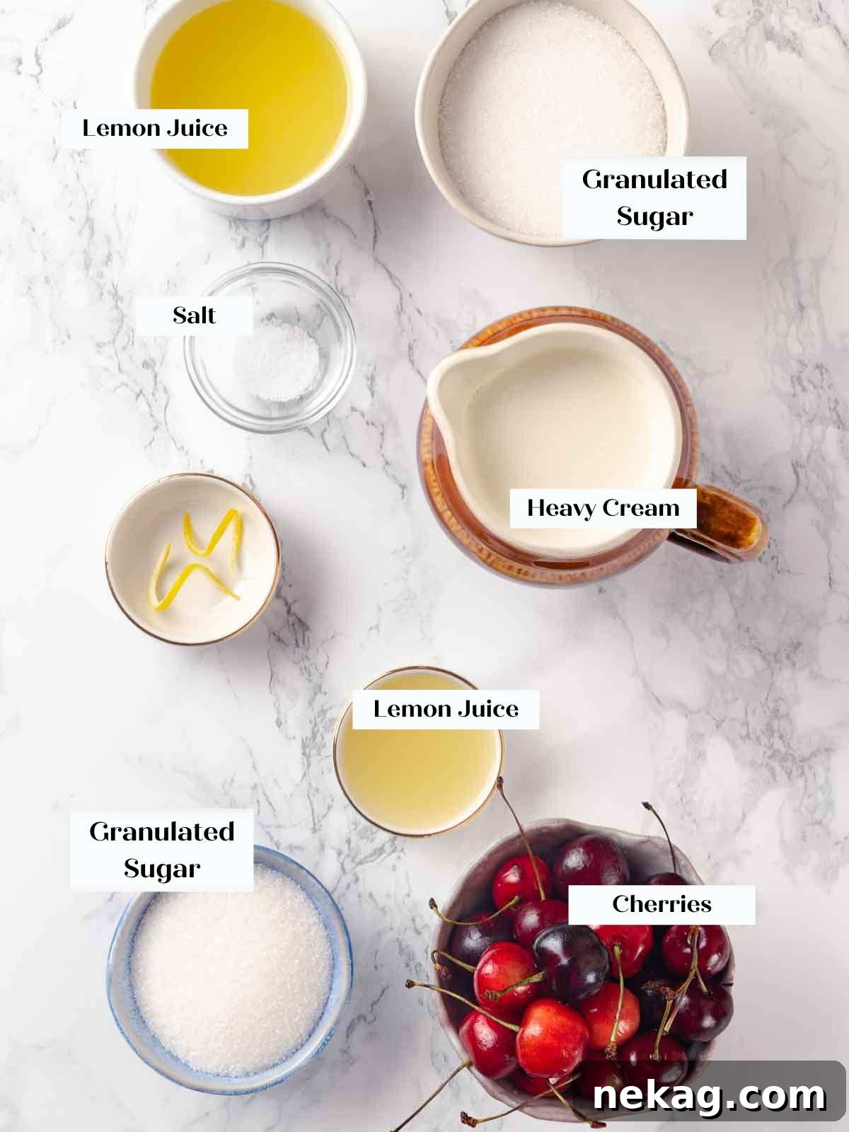 Velvet Lemon Delight 4 A beautiful flat lay of fresh, bright yellow lemons, a carton of heavy cream, a bowl of granulated sugar, and a bowl of vibrant fresh cherries. These are the key ingredients for making lemon posset and its optional cherry sauce.