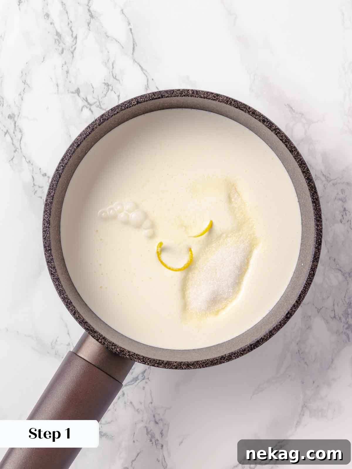 Velvet Lemon Delight 5 A saucepan on a stovetop with heavy cream, sugar, and lemon rind heating up, starting the posset preparation process.
