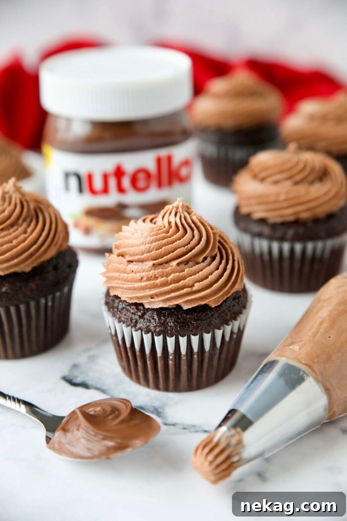 Nutella frosting piped on top of a chocolate cupcake.