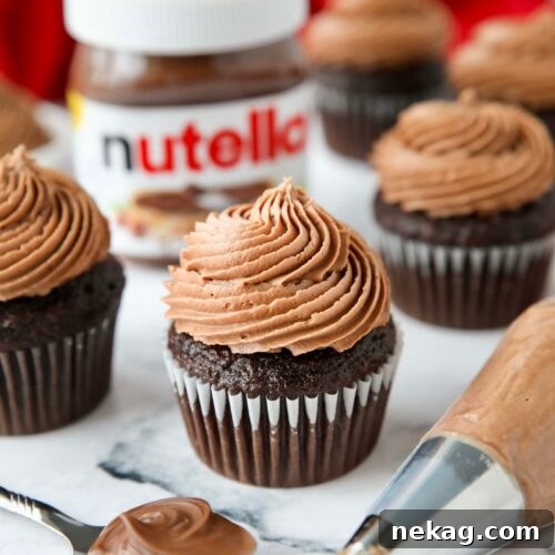 Nutella frosting piped on top of a chocolate cupcake.