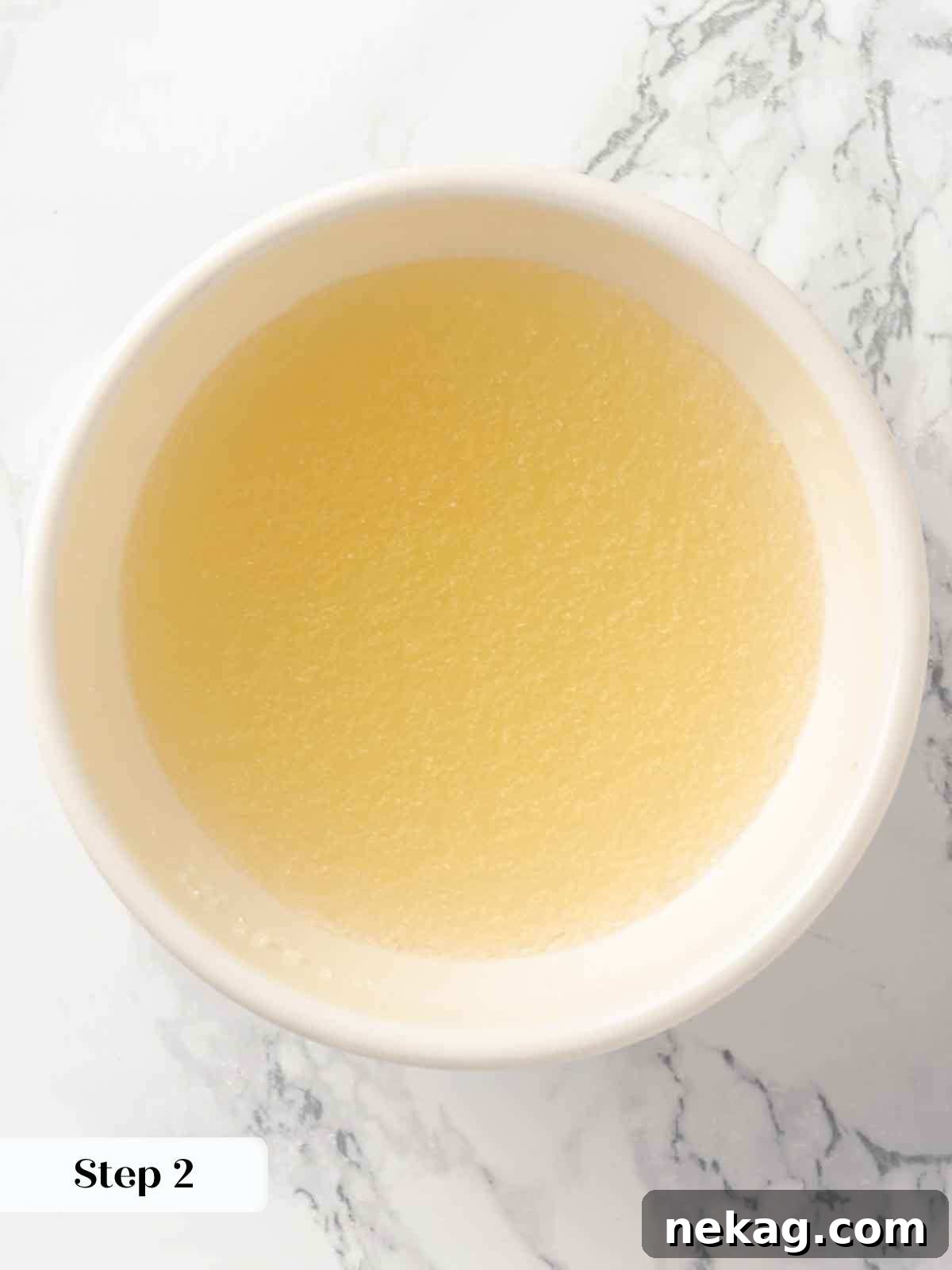Silken Buttermilk Delight 6 Bloomed gelatin in a small bowl, ready for use.
