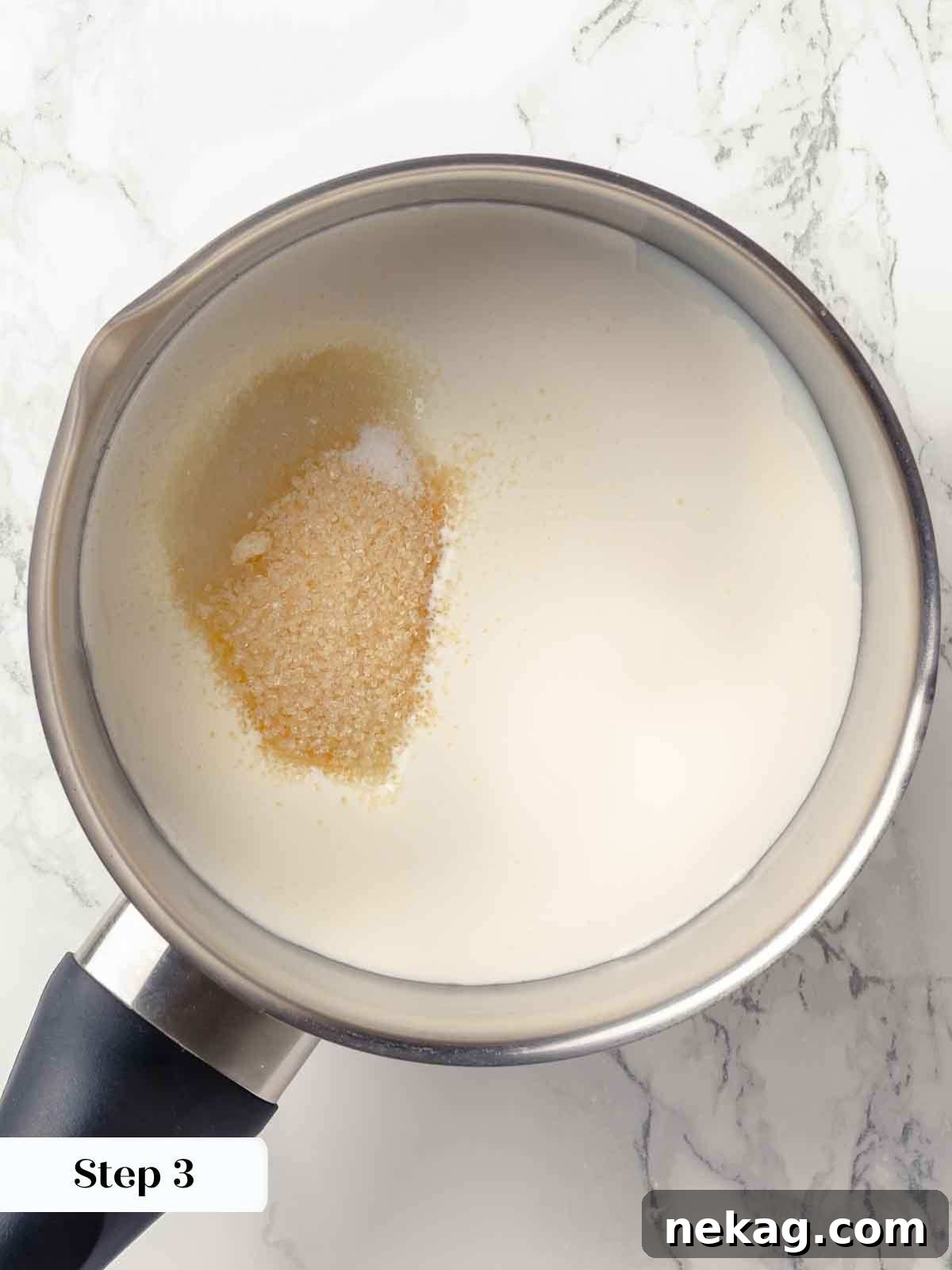 Silken Buttermilk Delight 7 A saucepan with cream and sugar being heated for panna cotta.