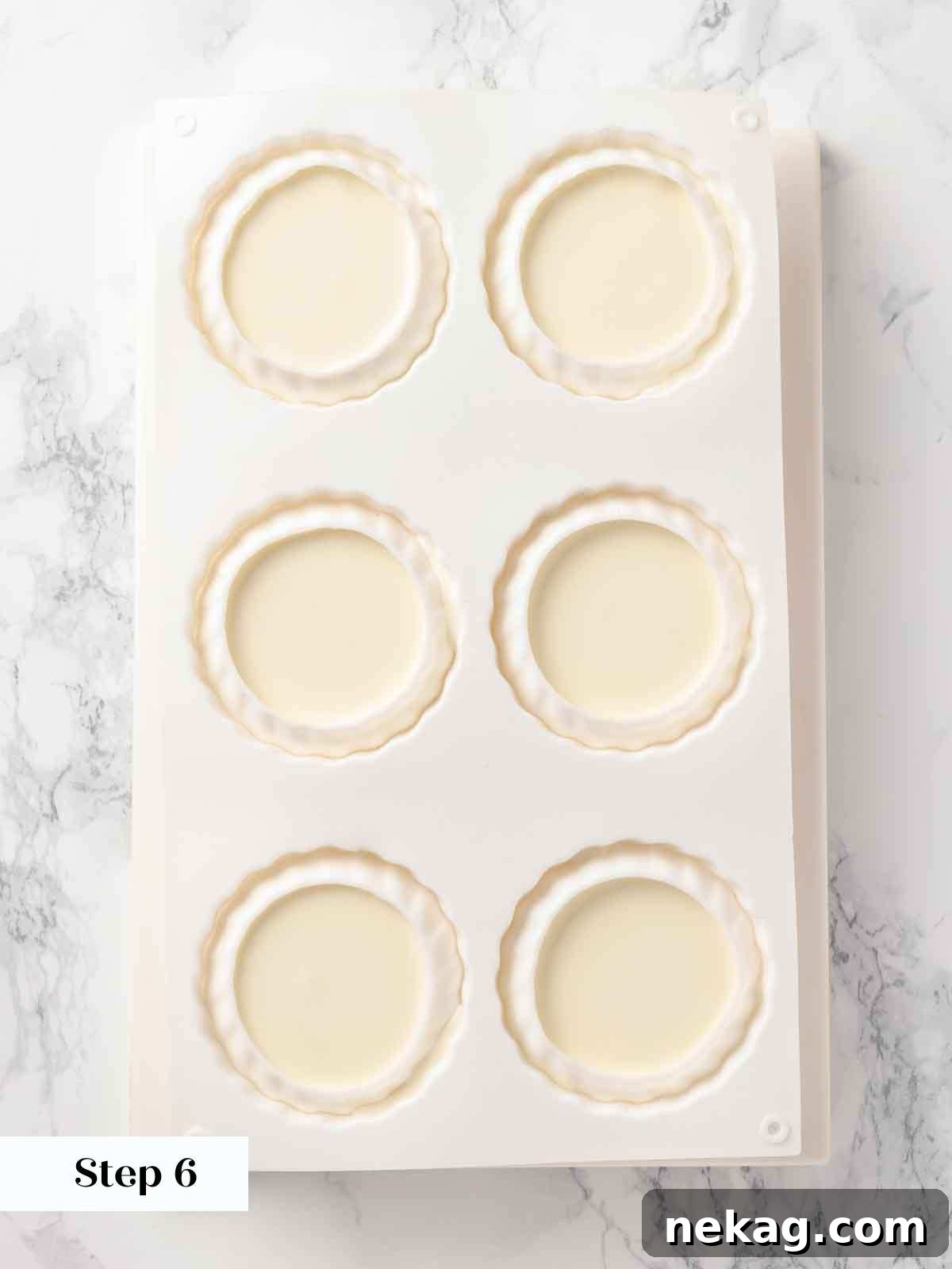 Silken Buttermilk Delight 10 Portioned and unmolded panna cottas on a tray.