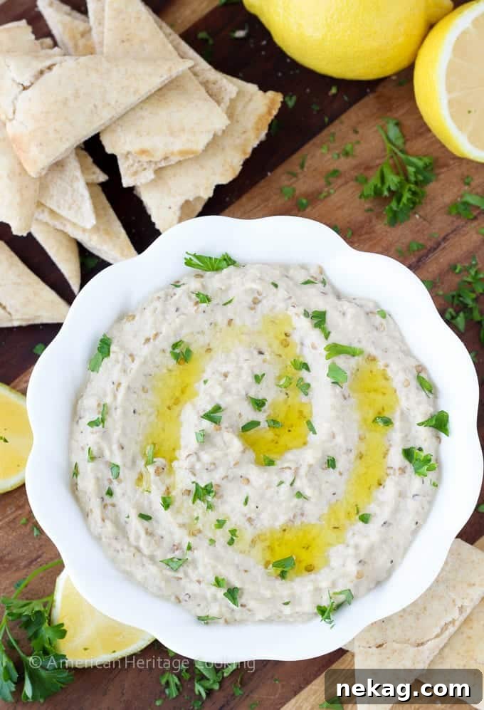Velvety Smoked Eggplant Dip 3 Close-up of a bowl of homemade Baba Ganoush with a rustic, slightly chunky texture, indicating fresh ingredients and careful preparation.