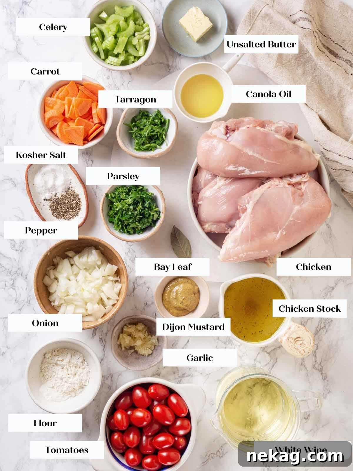 Chicken in wine sauce ingredients on white marble countertop.