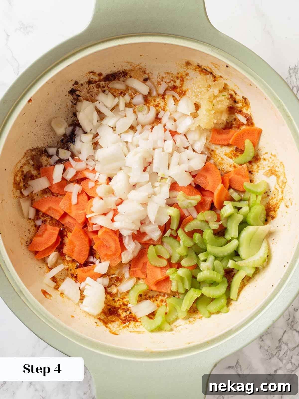 Chicken in wine sauce uncooked veggies.