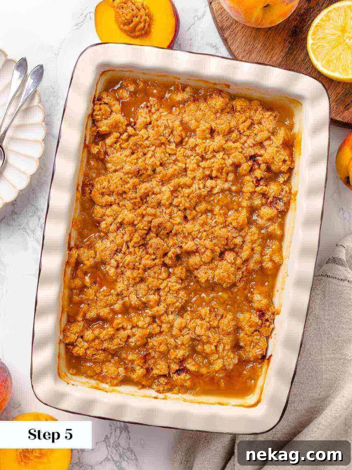 Warm Buttery Peach Crisp 12 Baked peach crisp fresh out of the oven, with a perfectly golden-brown, crispy top and bubbling filling.