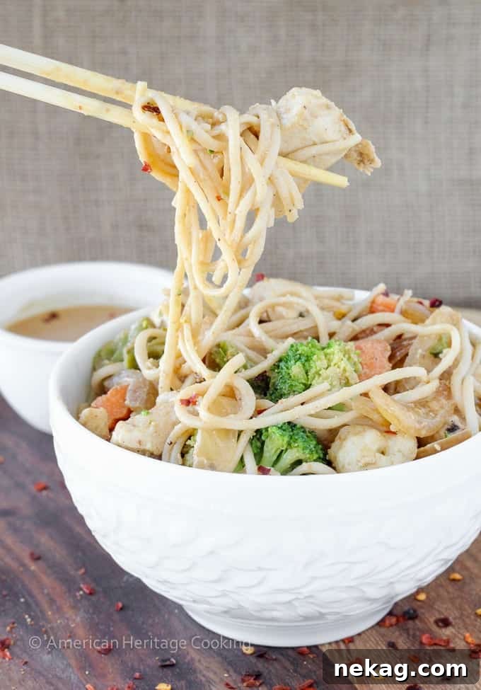 One Pan Thai Peanut Chicken Noodles 4 A close-up shot of the Thai Peanut Chicken Noodle Stir Fry, showcasing the vibrant colors of the vegetables and the succulent chicken pieces.