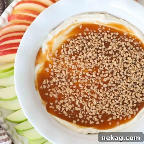 Top view of cream cheese, caramel, and toffee dip in a bowl.