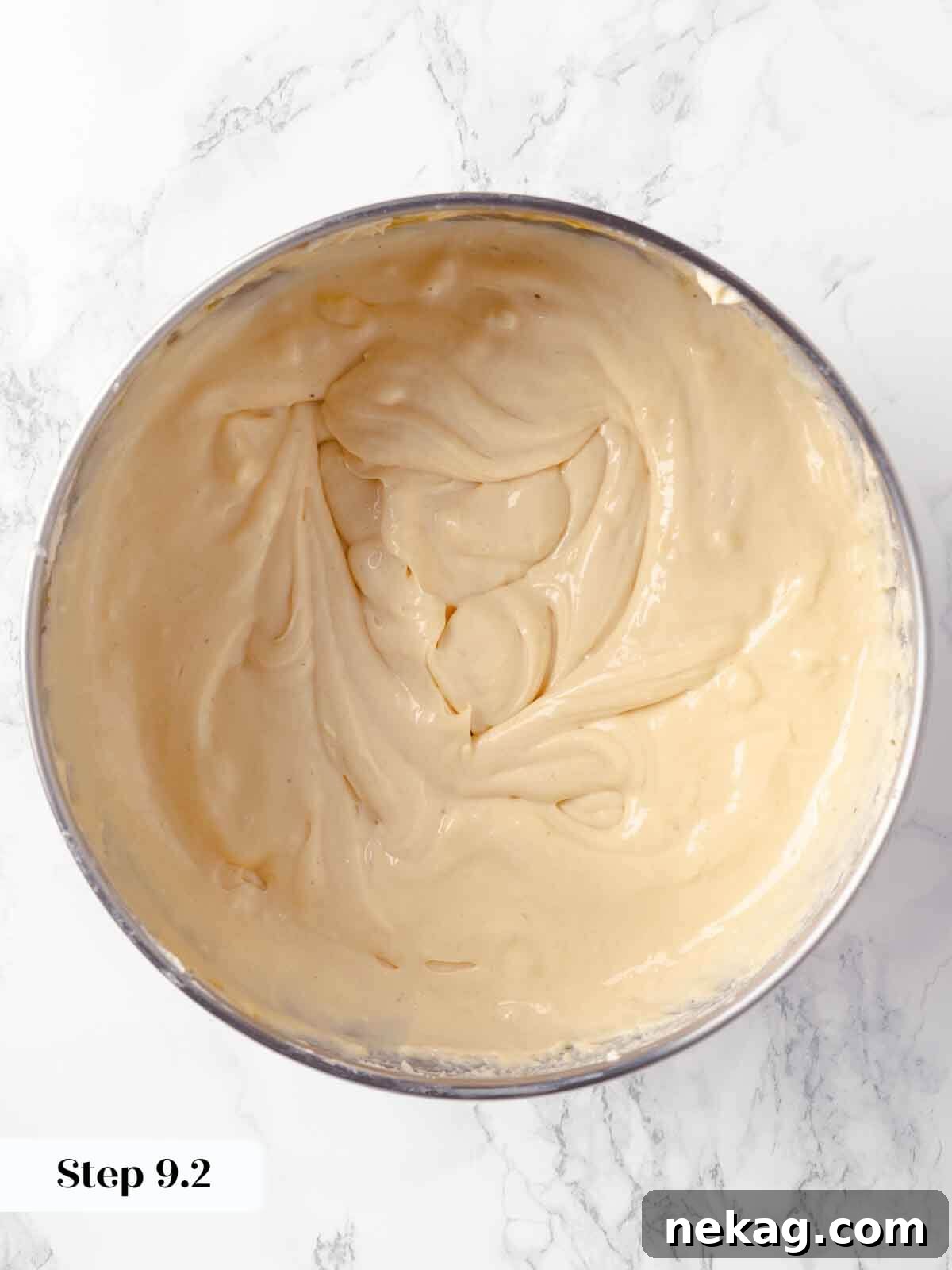 Velvet Pumpkin Bliss 13 The pumpkin cheesecake batter after eggs have been beaten in, showing smooth texture.