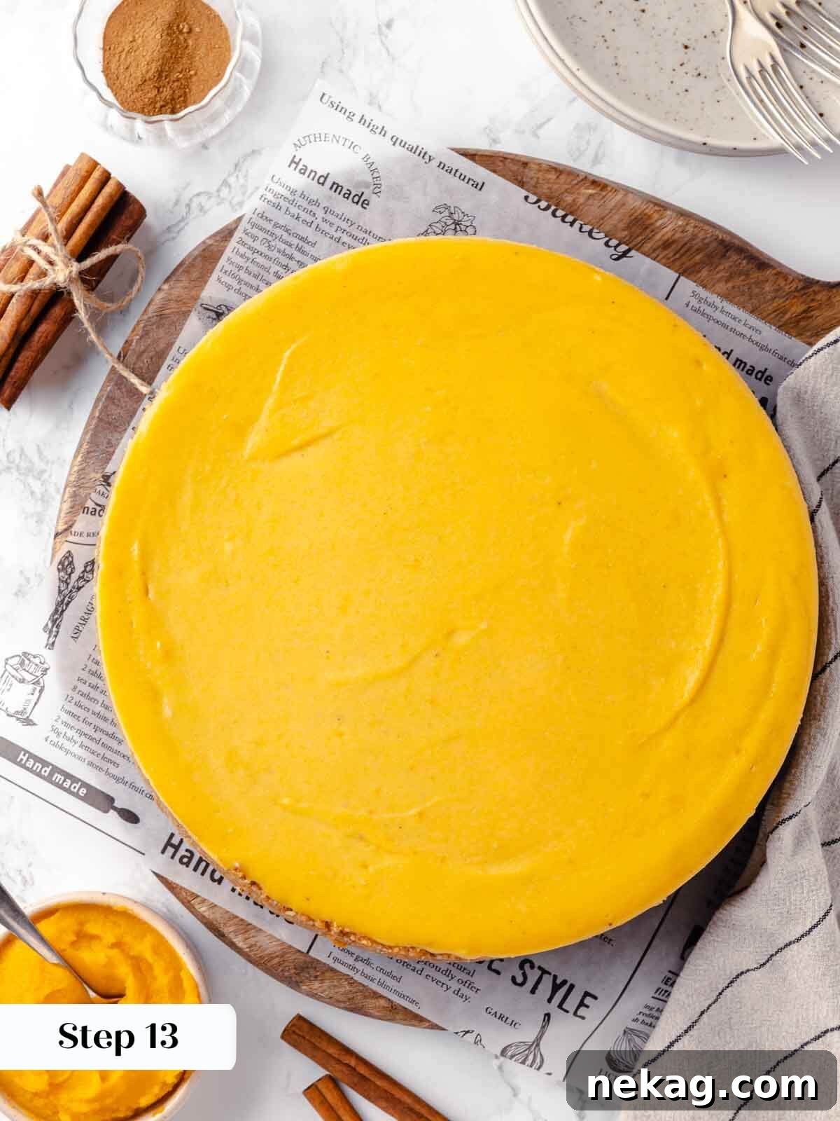 Velvet Pumpkin Bliss 18 A baked pumpkin cheesecake cooling on a wire rack.