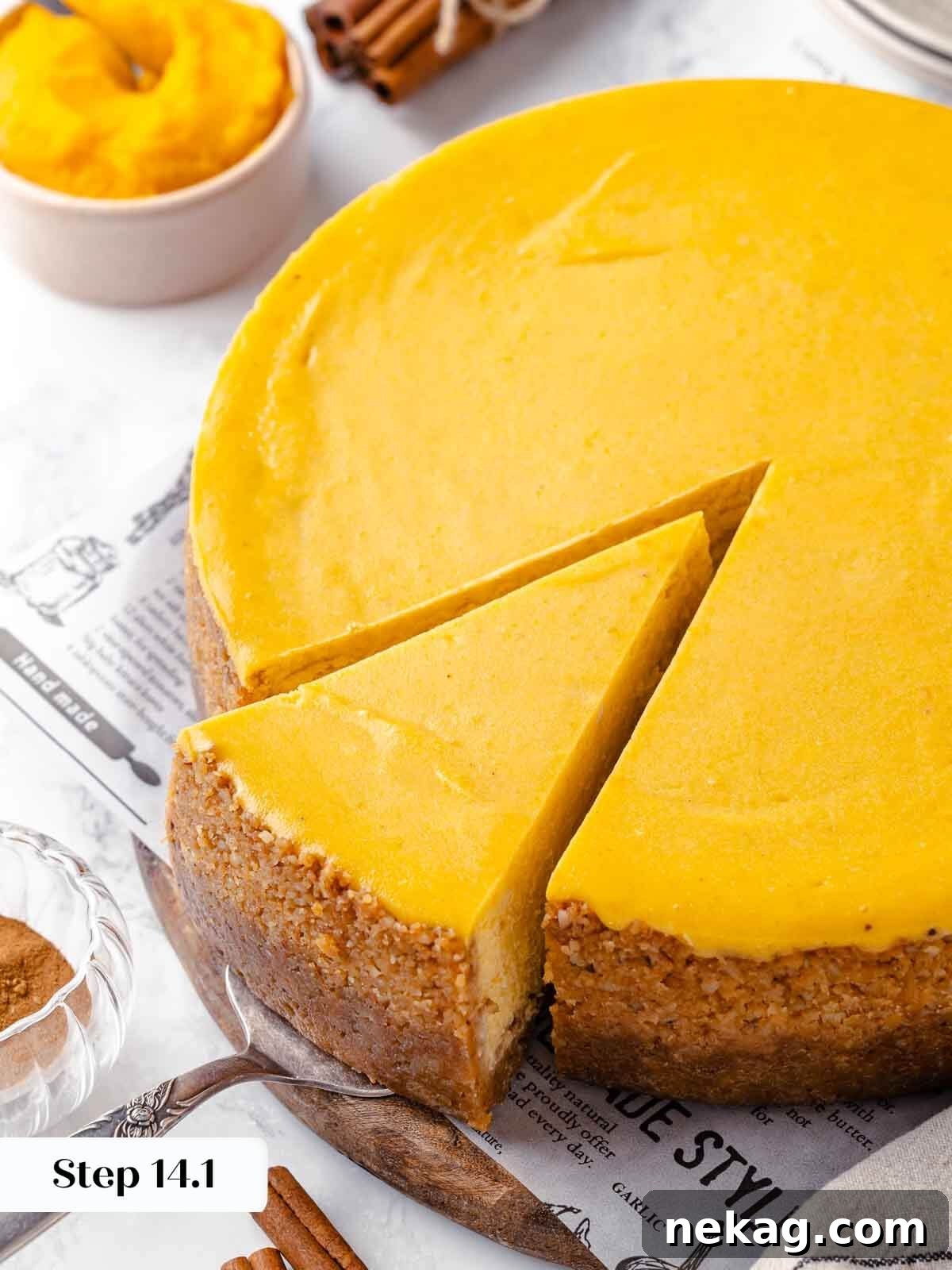 Velvet Pumpkin Bliss 19 A perfectly sliced pumpkin cheesecake, ready to be served.