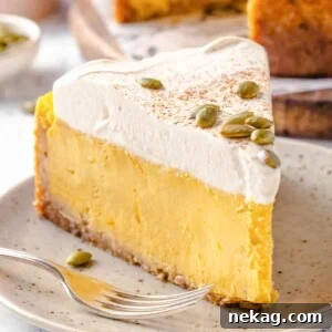 Pumpkin cheesecake on a beige plate, garnished and ready to serve.
