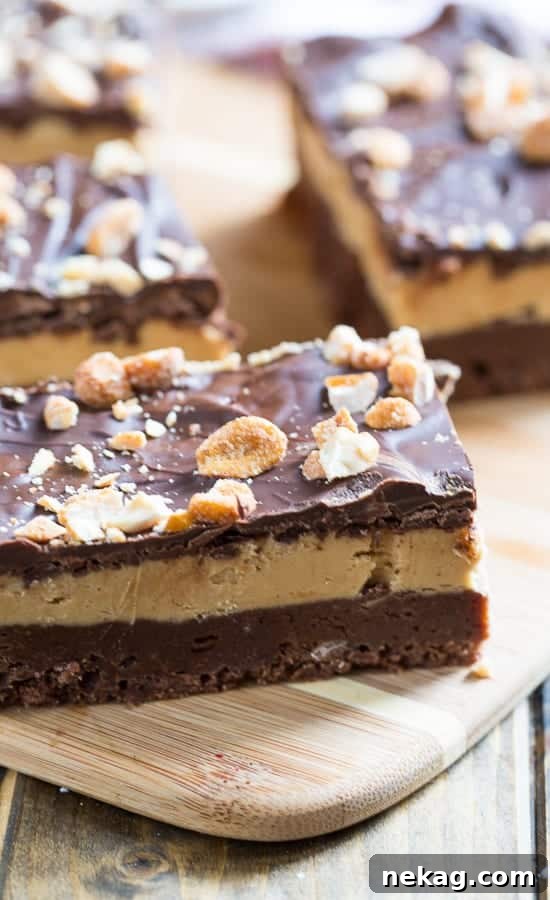 Decadent No-Bake Chocolate Peanut Butter Bars 4 Up-close shot of Chocolate Peanut Butter Bars showing the distinct layers