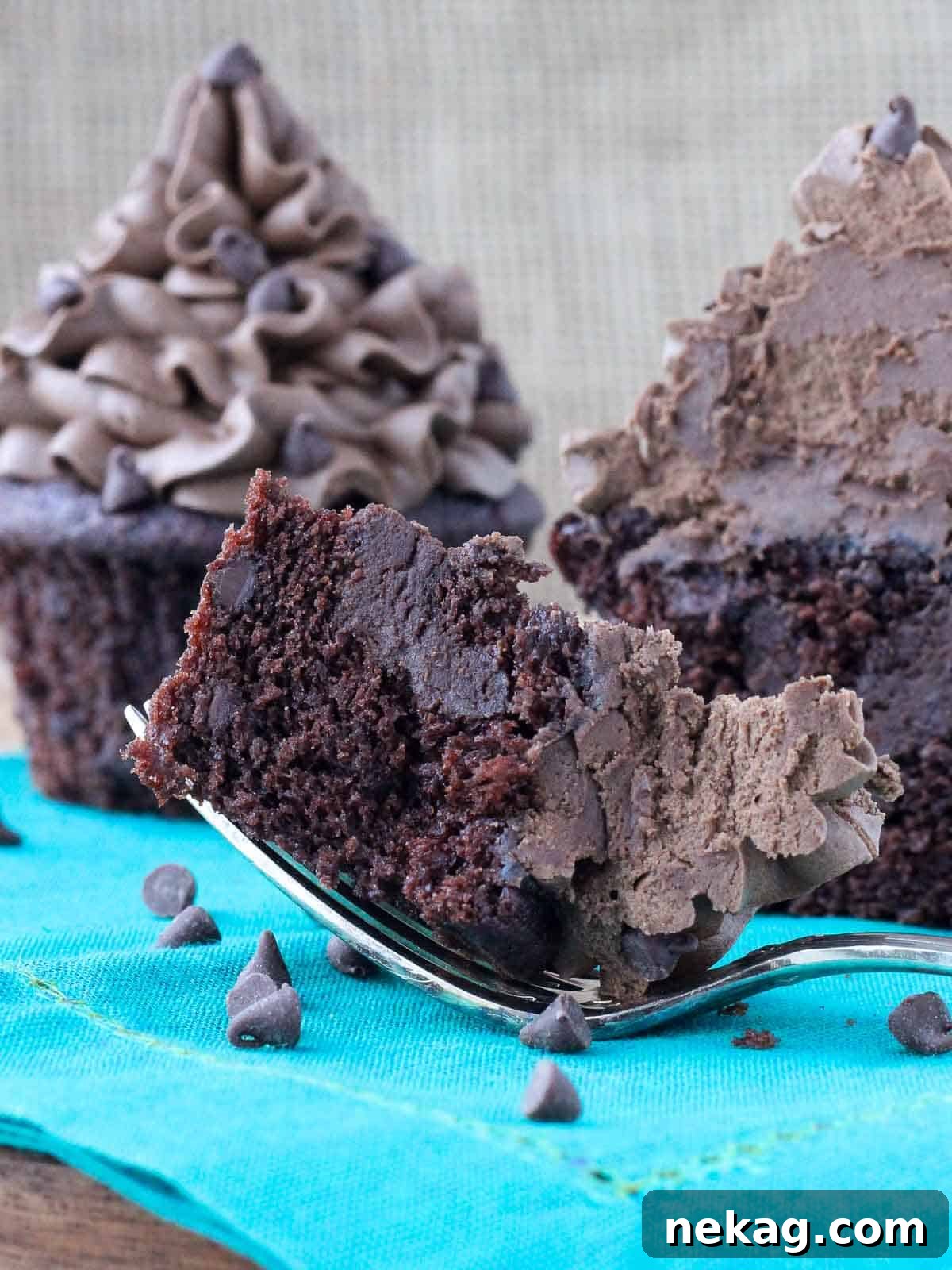 chocolate cupcake with chocolate ganache filling bite on fork.