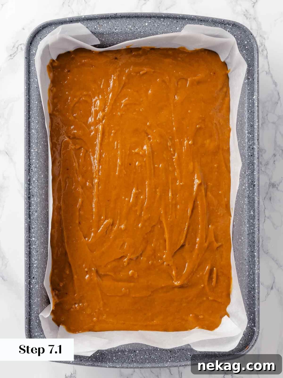 Autumn Spice Squares 10 Smooth, even layer of pumpkin bar batter spread into a parchment-lined baking dish.