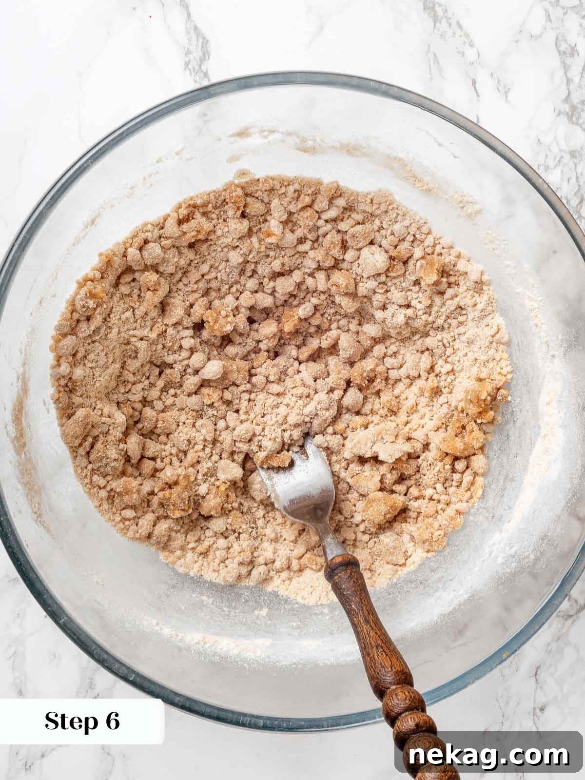 Melted butter added to apple cobbler batter.