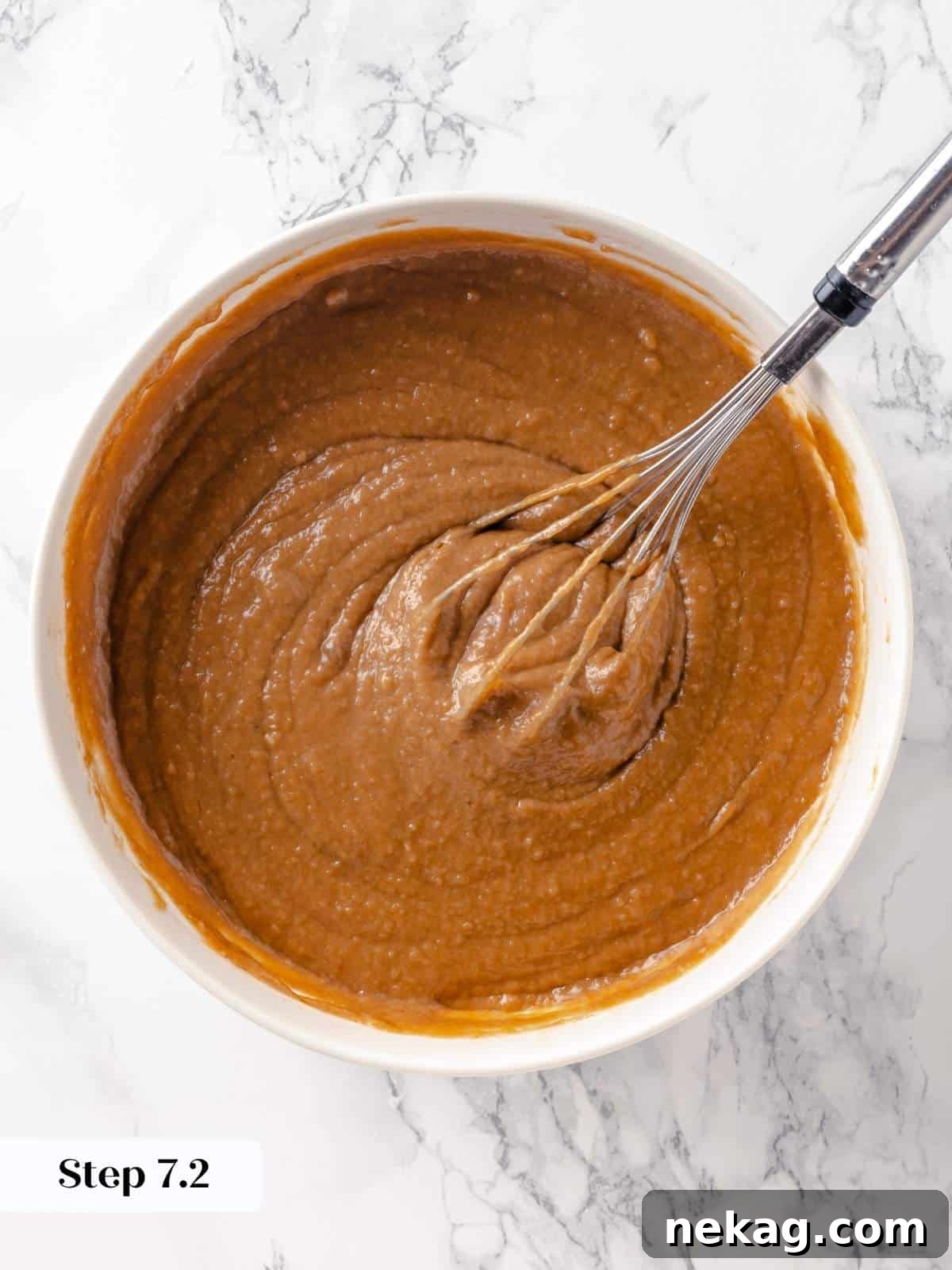 Spiced Applesauce Comfort Cake 12 Smooth, well-mixed applesauce cake batter in a bowl.