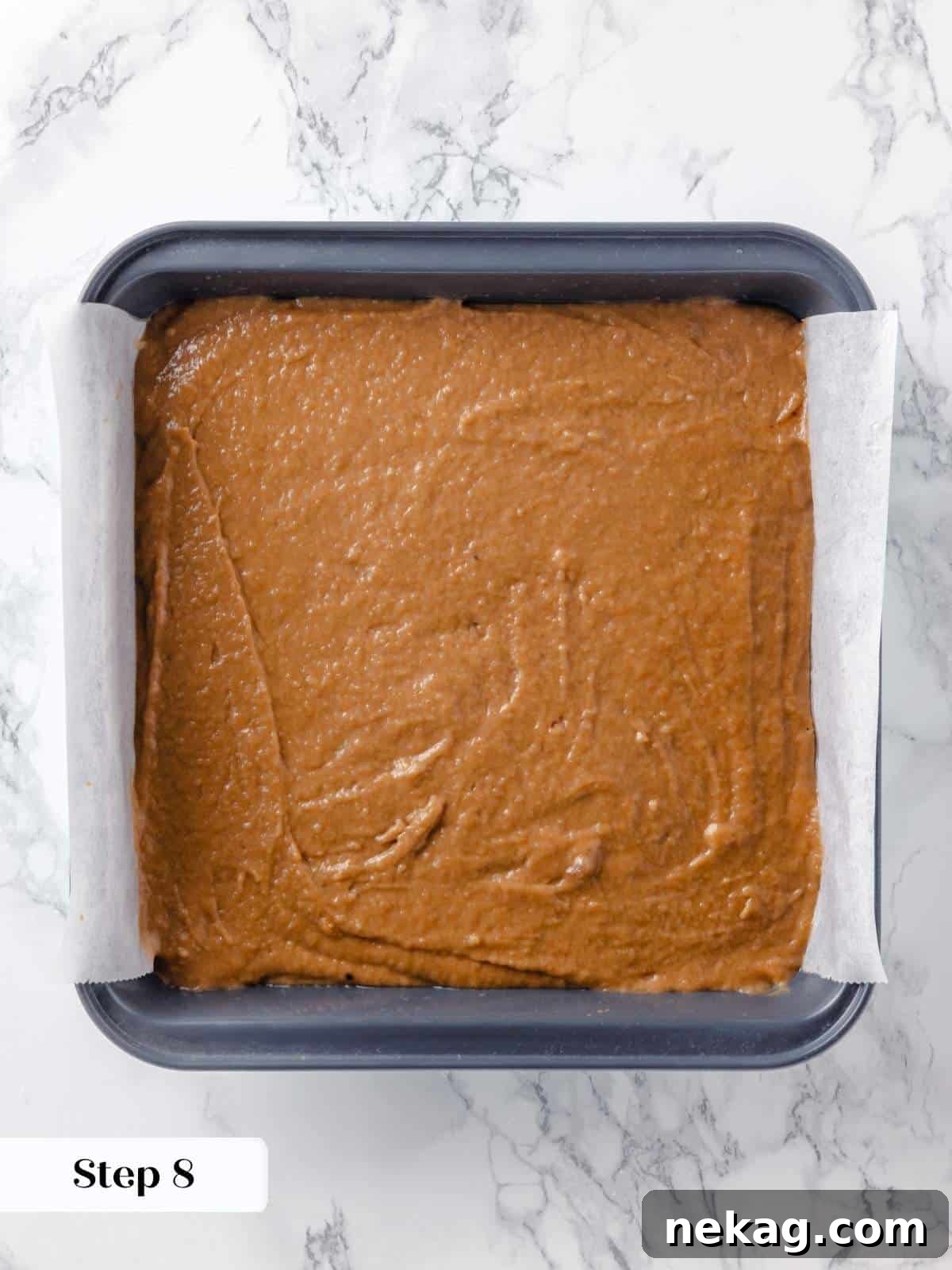 Spiced Applesauce Comfort Cake 13 Applesauce cake batter poured into a prepared baking pan.