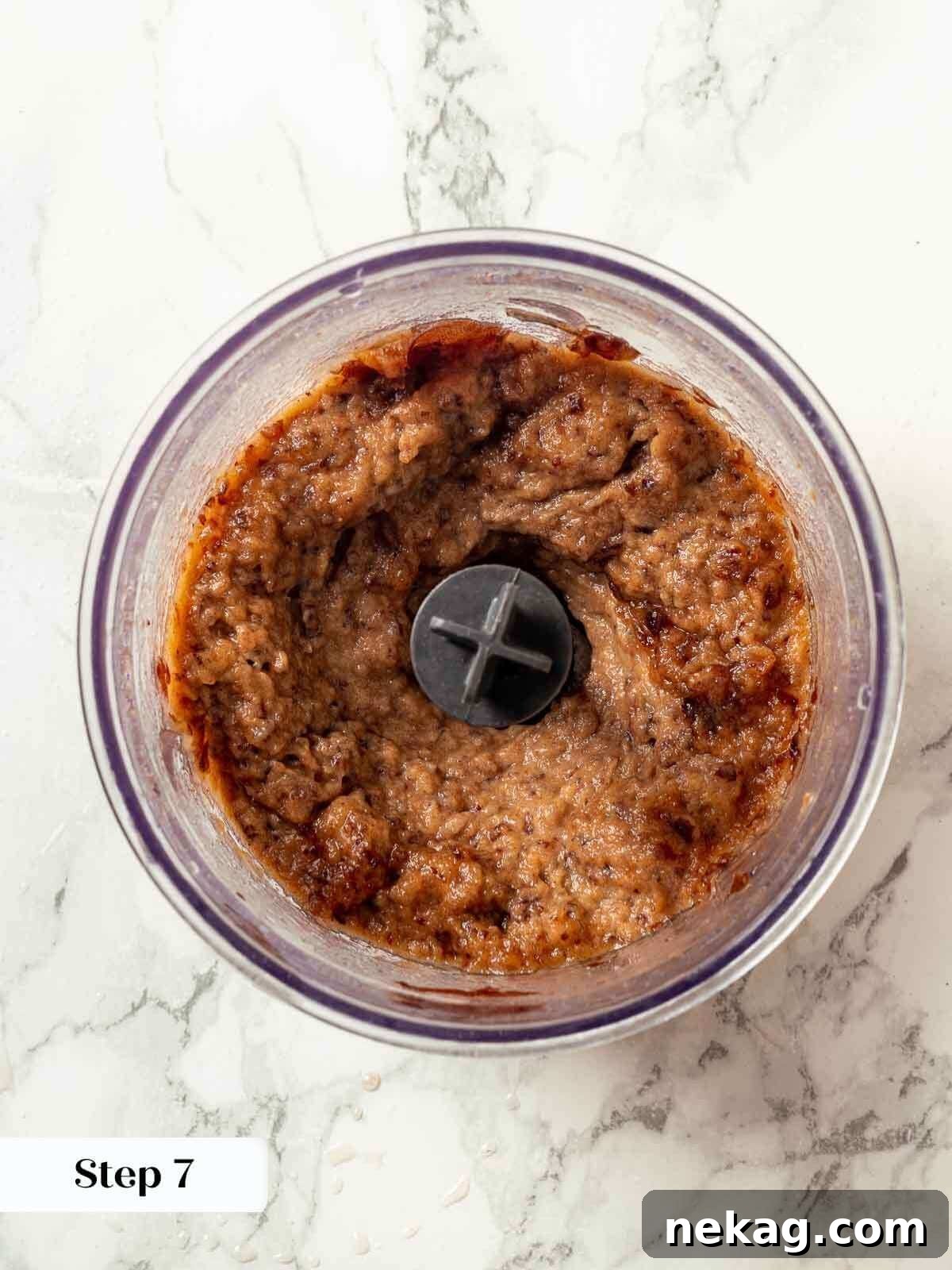 Pureed dates in a food processor, perfectly prepared for adding to the sticky toffee pudding batter.
