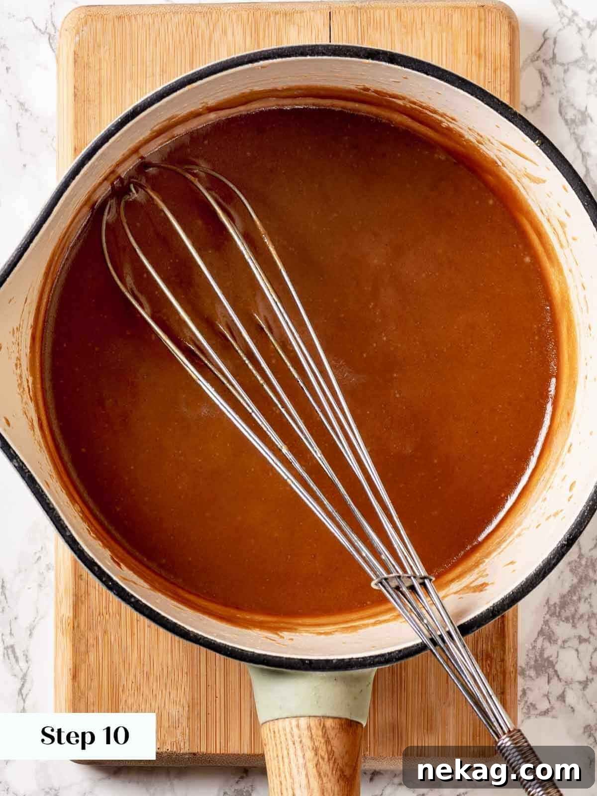 Toffee sauce gently simmering in a saucepan, becoming rich and thick, ready for the puddings.