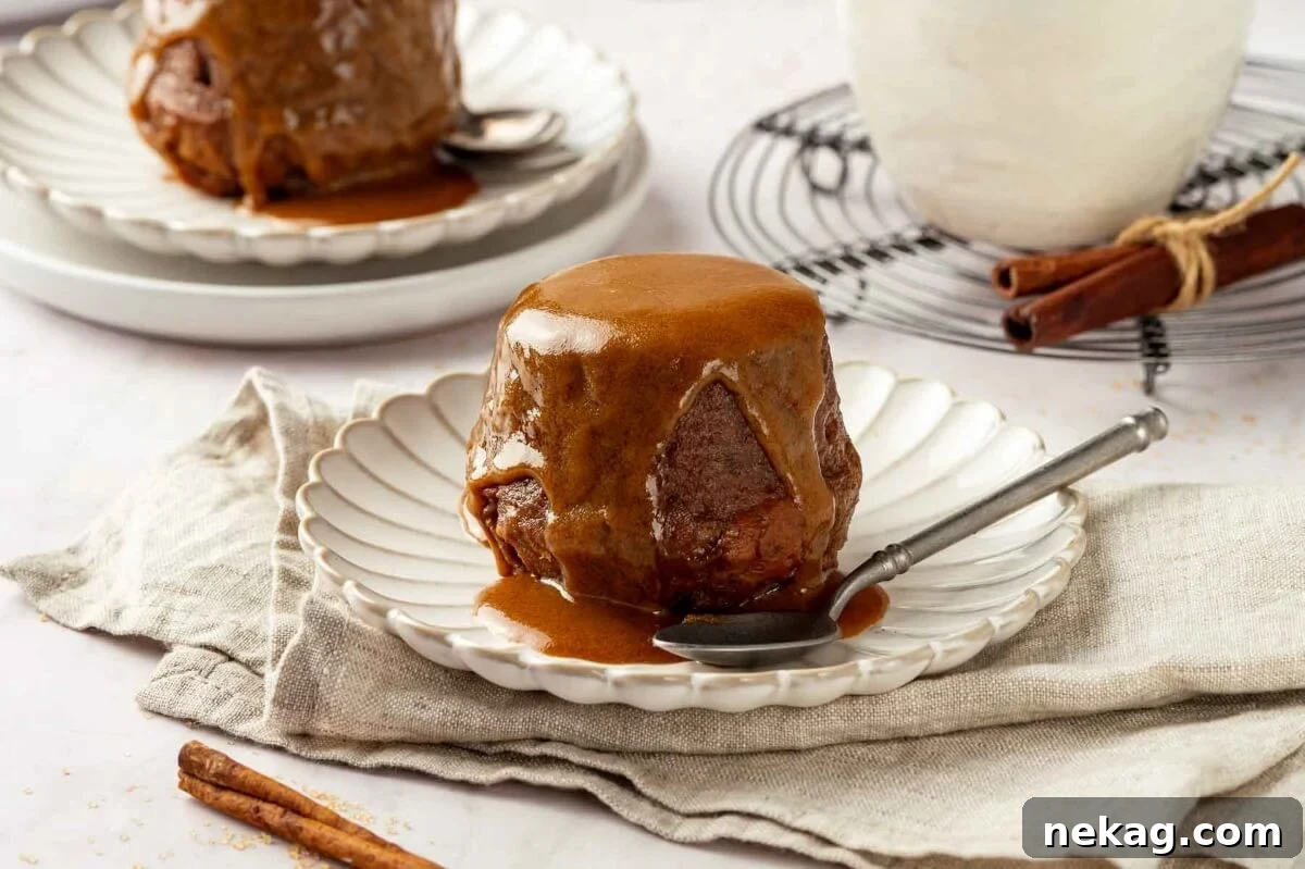 Sticky toffee pudding served elegantly on white plates, ready to be enjoyed.