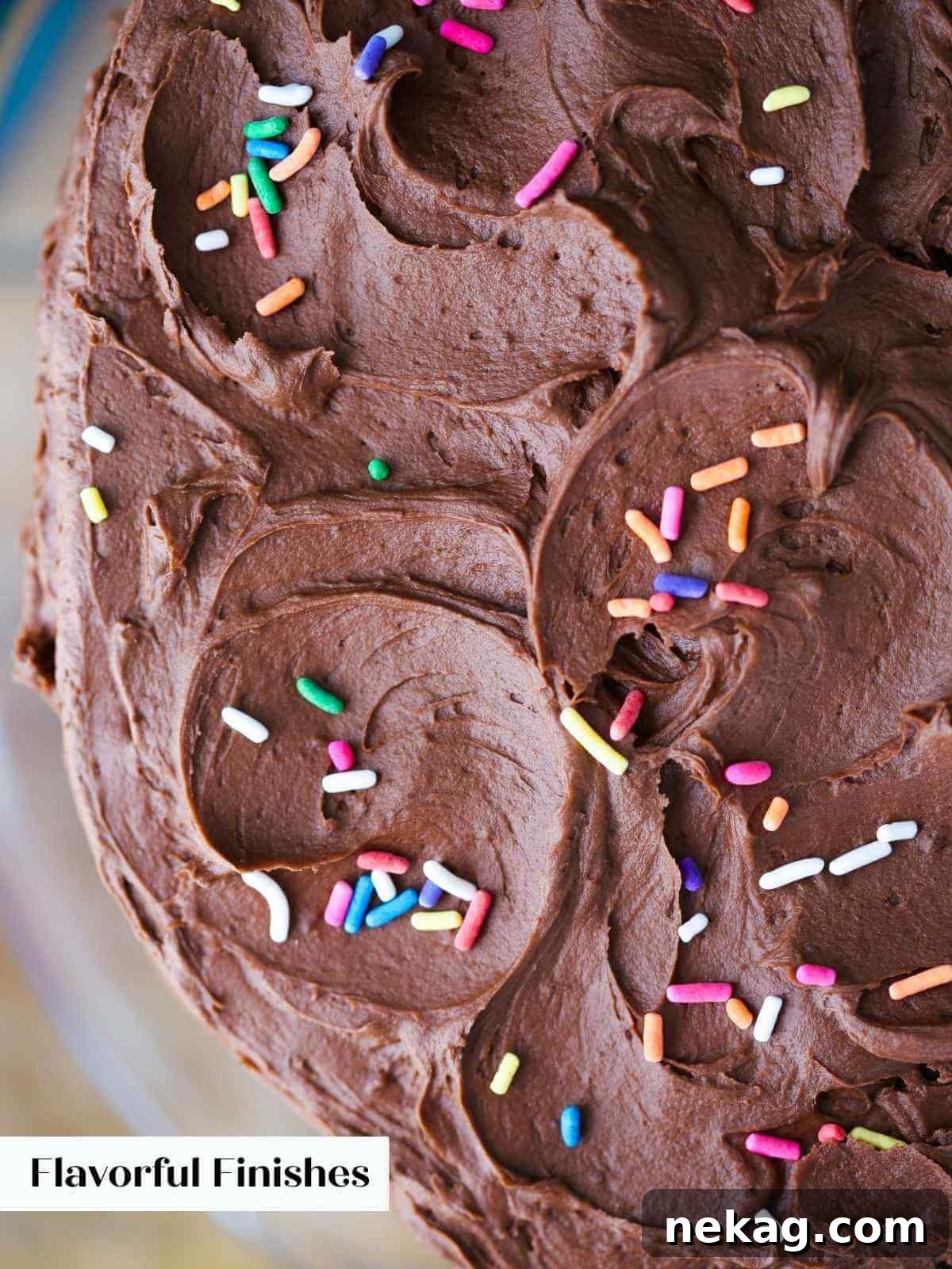 A vibrant close-up of colorful rainbow sprinkles generously scattered over a rich cake covered in decadent chocolate icing, inviting indulgence.
