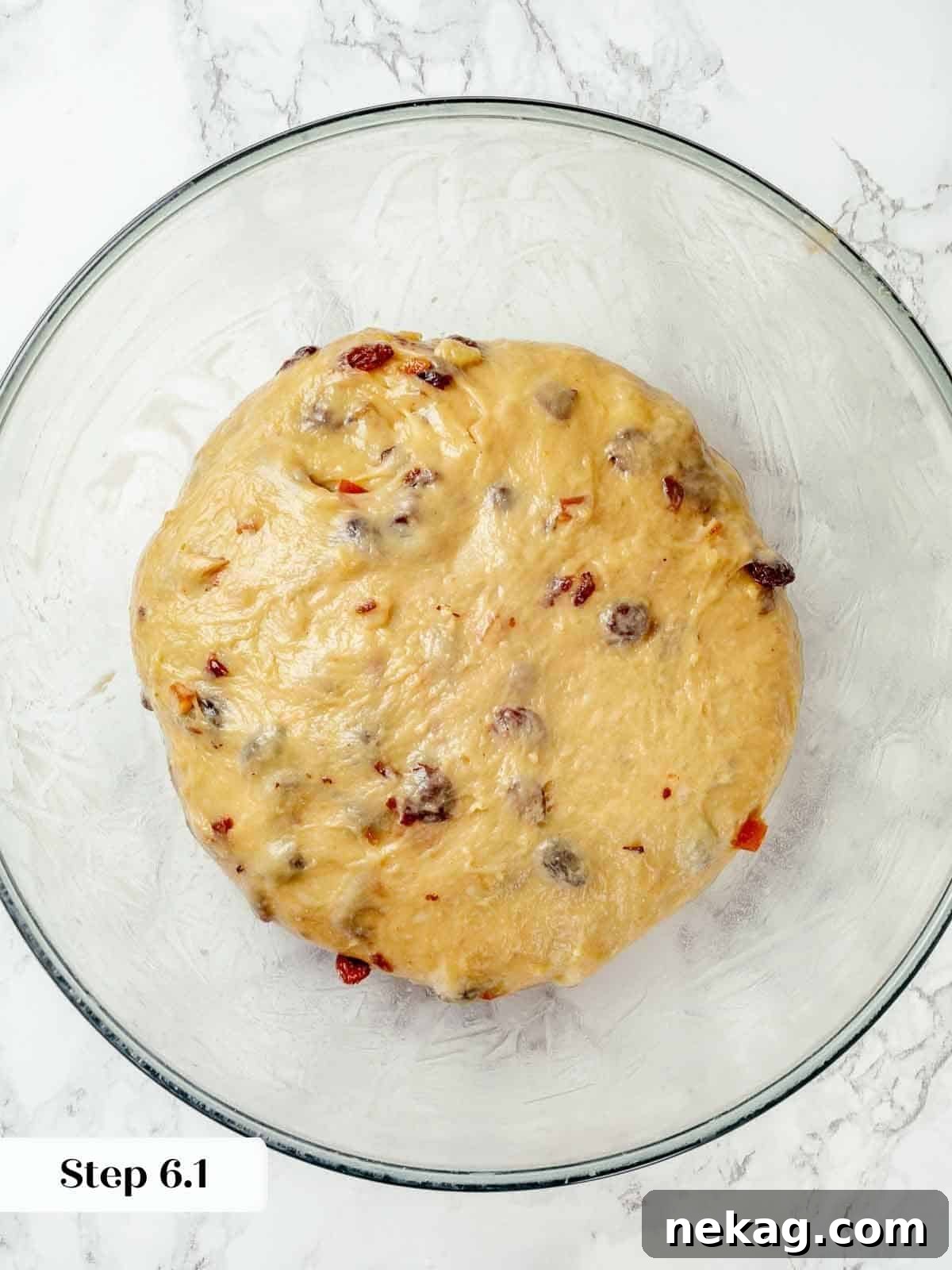 Panettone dough resting in a lightly oiled bowl, covered for bulk fermentation.