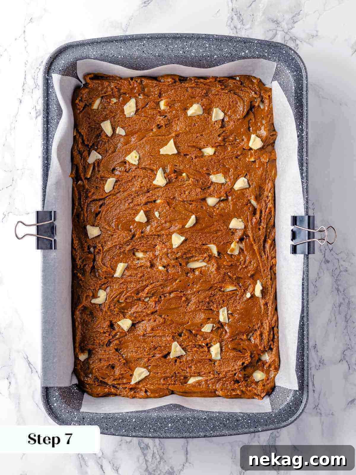 Festive Gingerbread Blondies 11 Unbaked gingerbread blondie batter, perfectly smoothed and spread evenly into a rectangular baking pan, glistening and ready to enter the hot oven for transformation.