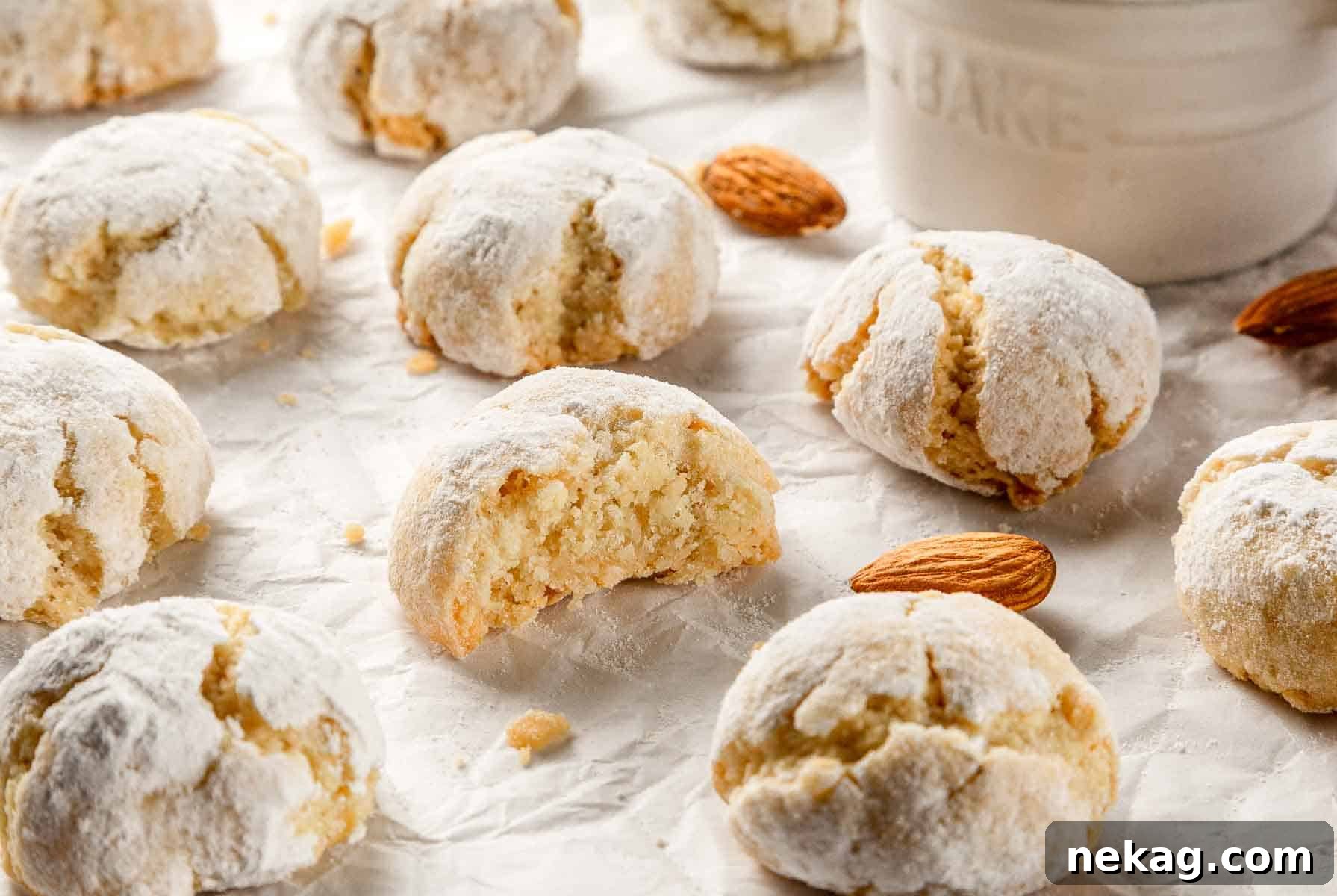 Delicate Amaretti Bites 3 A close-up of a perfectly round soft amaretti cookie, showing its crackled sugar coating and light golden-brown edge.