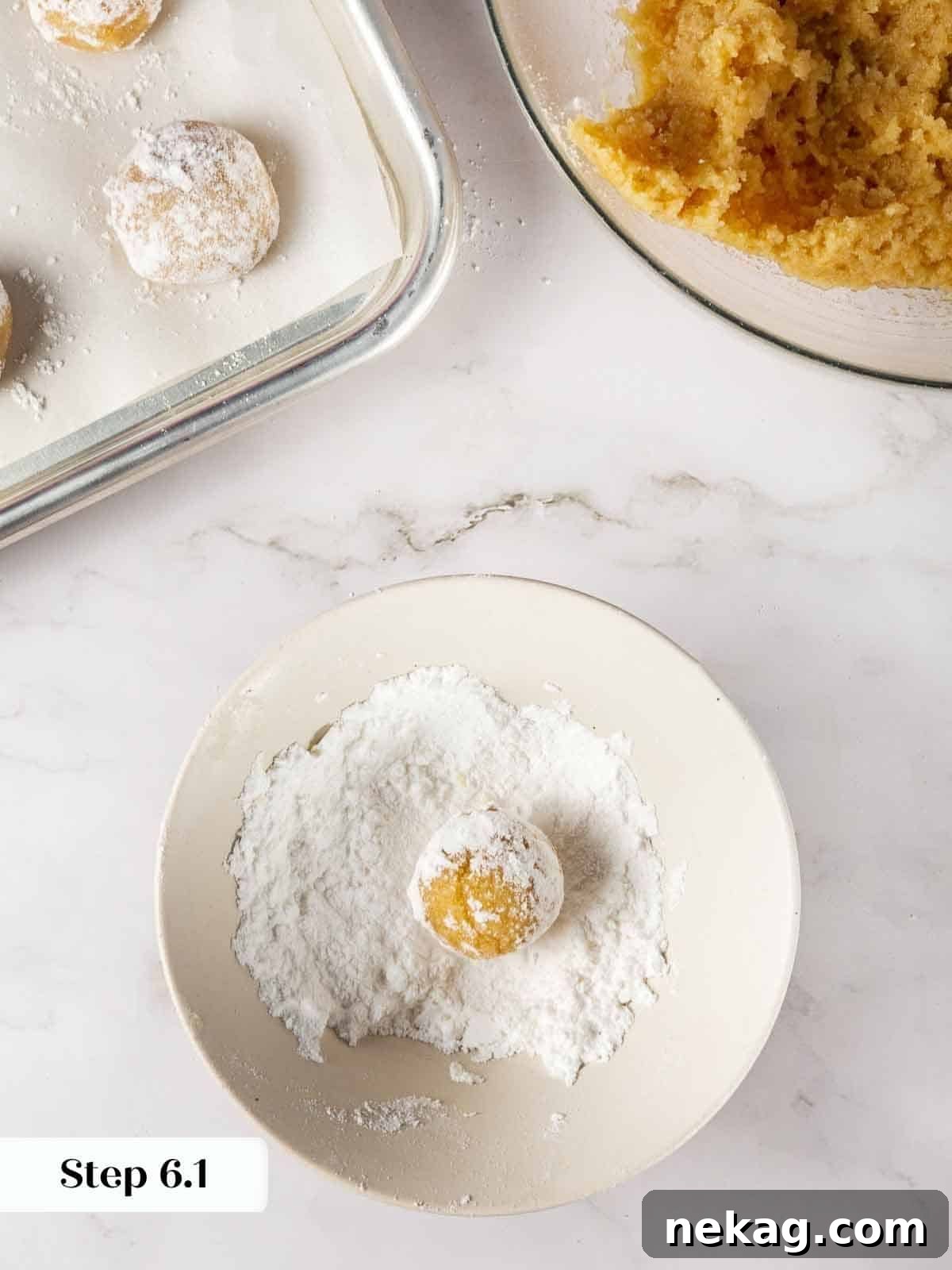 Delicate Amaretti Bites 9 Amaretti cookie dough balls generously coated in powdered sugar.