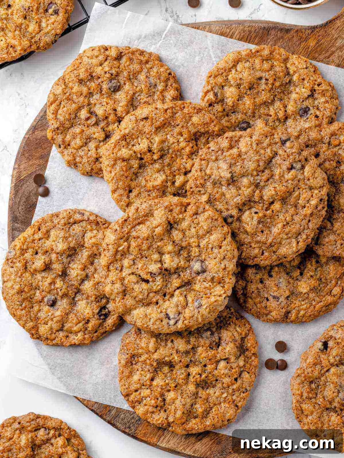 Hearty Cowboy Cookie Bake 16 A baking tray laden with freshly baked cowboy cookies, golden-brown and textured with visible mix-ins, cooling gracefully, hinting at their delicious warmth and chewiness.