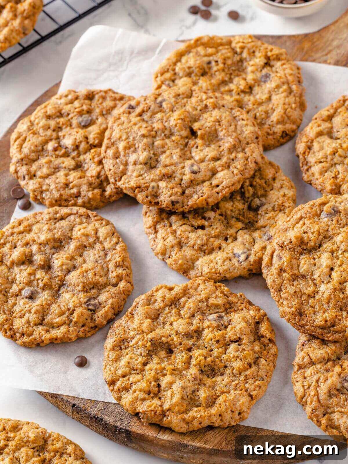 Hearty Cowboy Cookie Bake 5 A close-up of perfectly golden brown cowboy cookies with visibly crisp edges and tender, chewy centers, showcasing their abundant mix-ins and inviting texture.