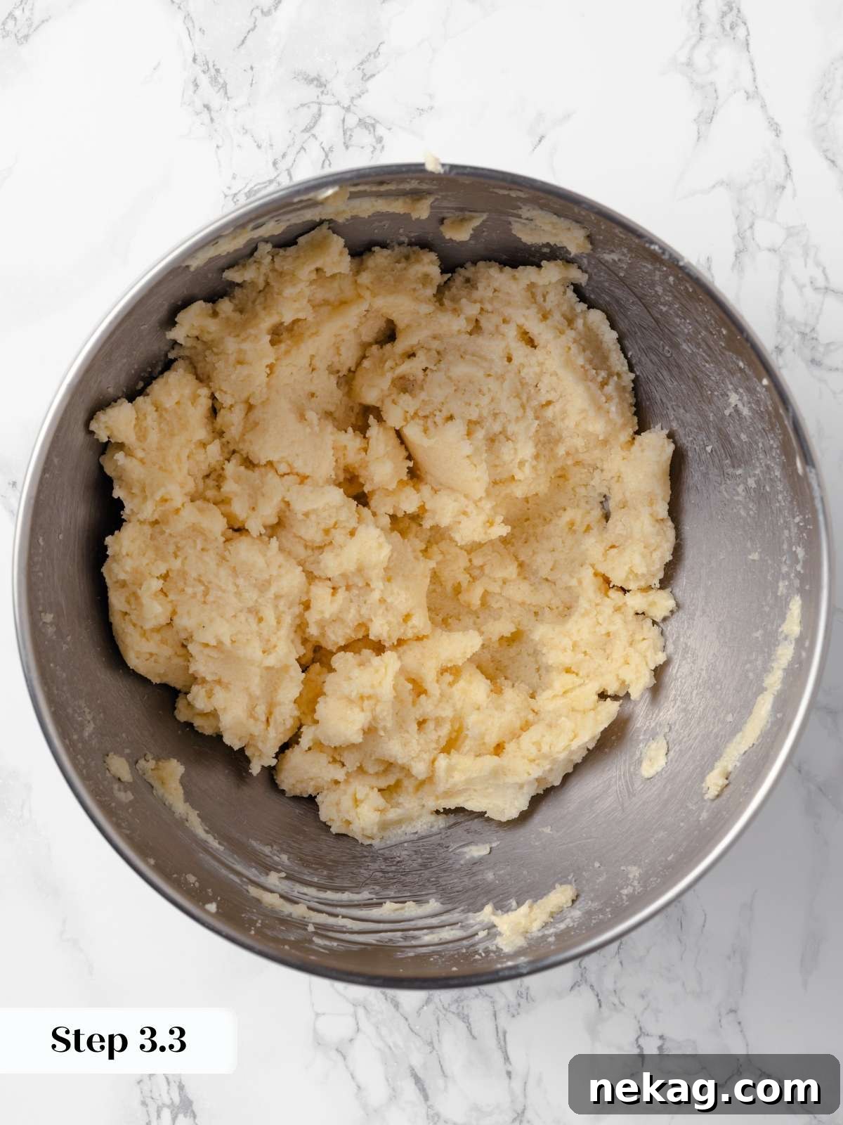 Hearty Cowboy Cookie Bake 8 The butter and sugars being thoroughly beaten together in a stand mixer, creating a fluffy, pale, and well-aerated mixture, signifying optimal creaming for tender cookies.