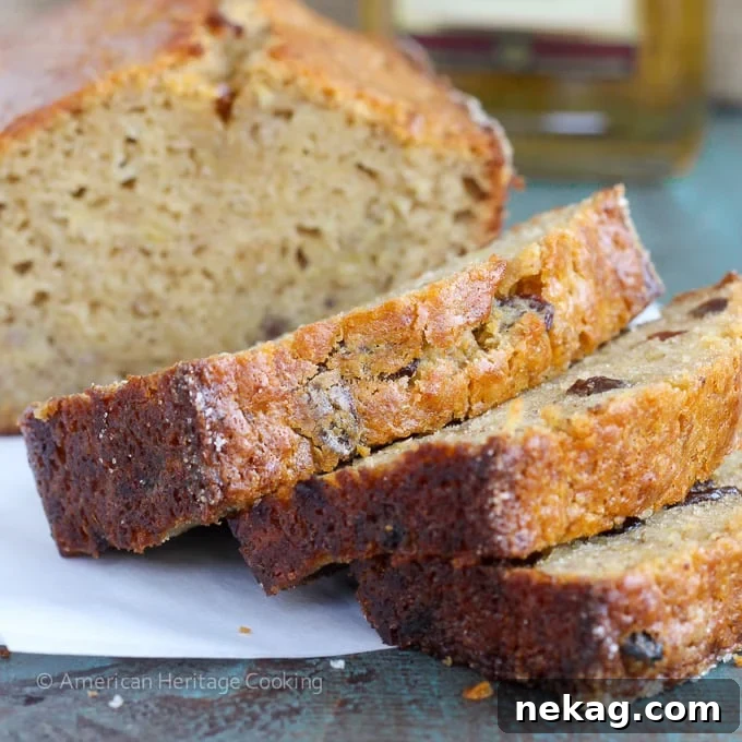 Decadent Brown Butter Rum Raisin Banana Bread 4 Overhead view of a loaf of Brown Butter Rum Raisin Banana Bread cooling on a wire rack.