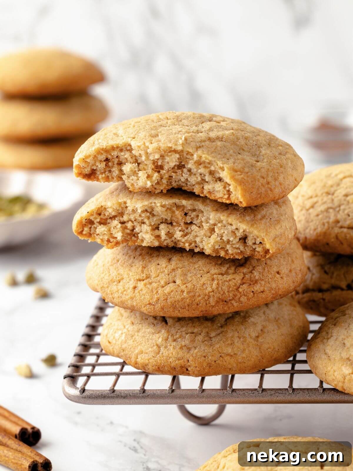 A perfectly baked chai sugar cookie with golden, slightly cracked edges, showcasing its chewy texture.