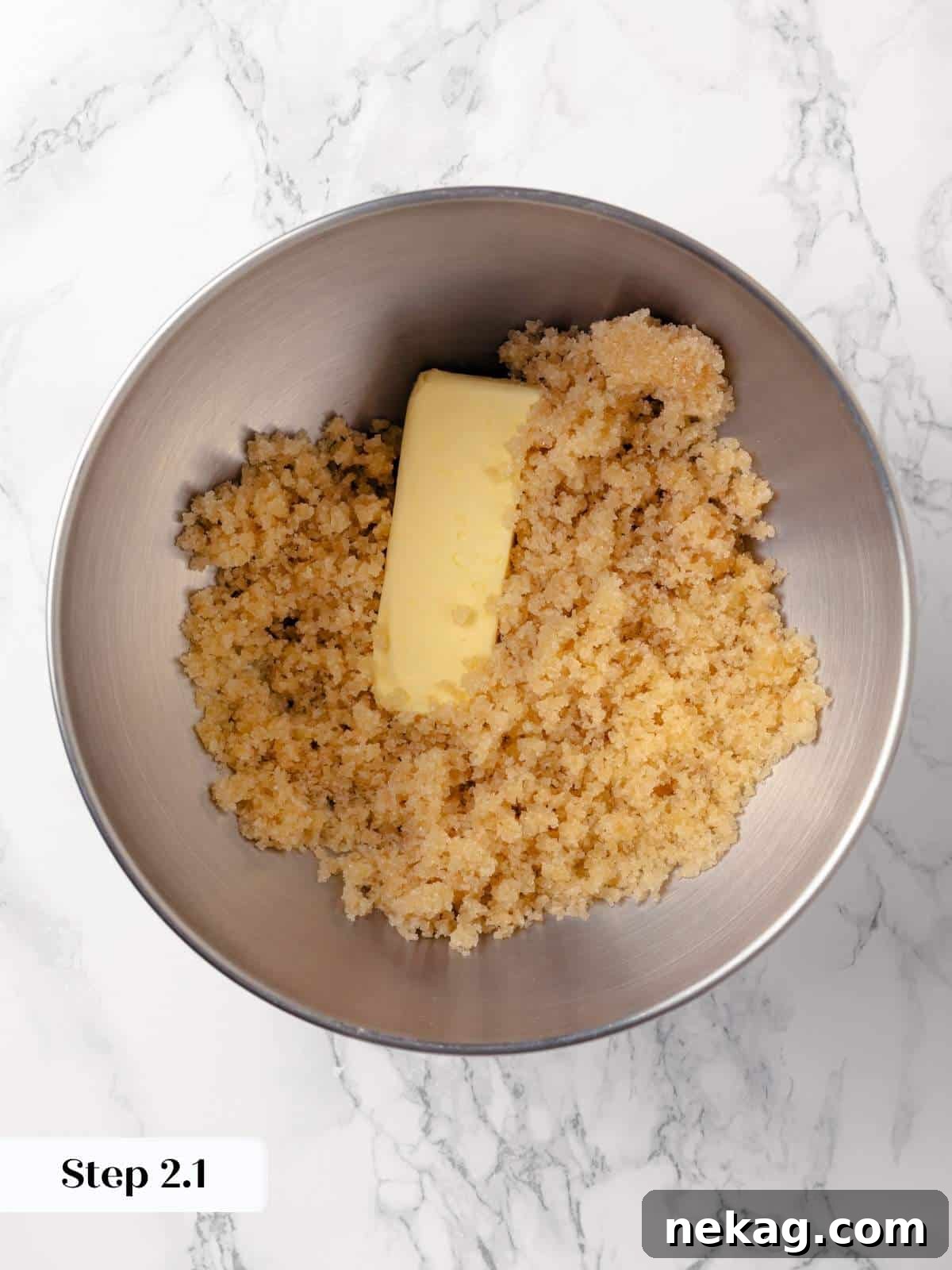 Egg and vanilla extract added to creamed butter and sugar.