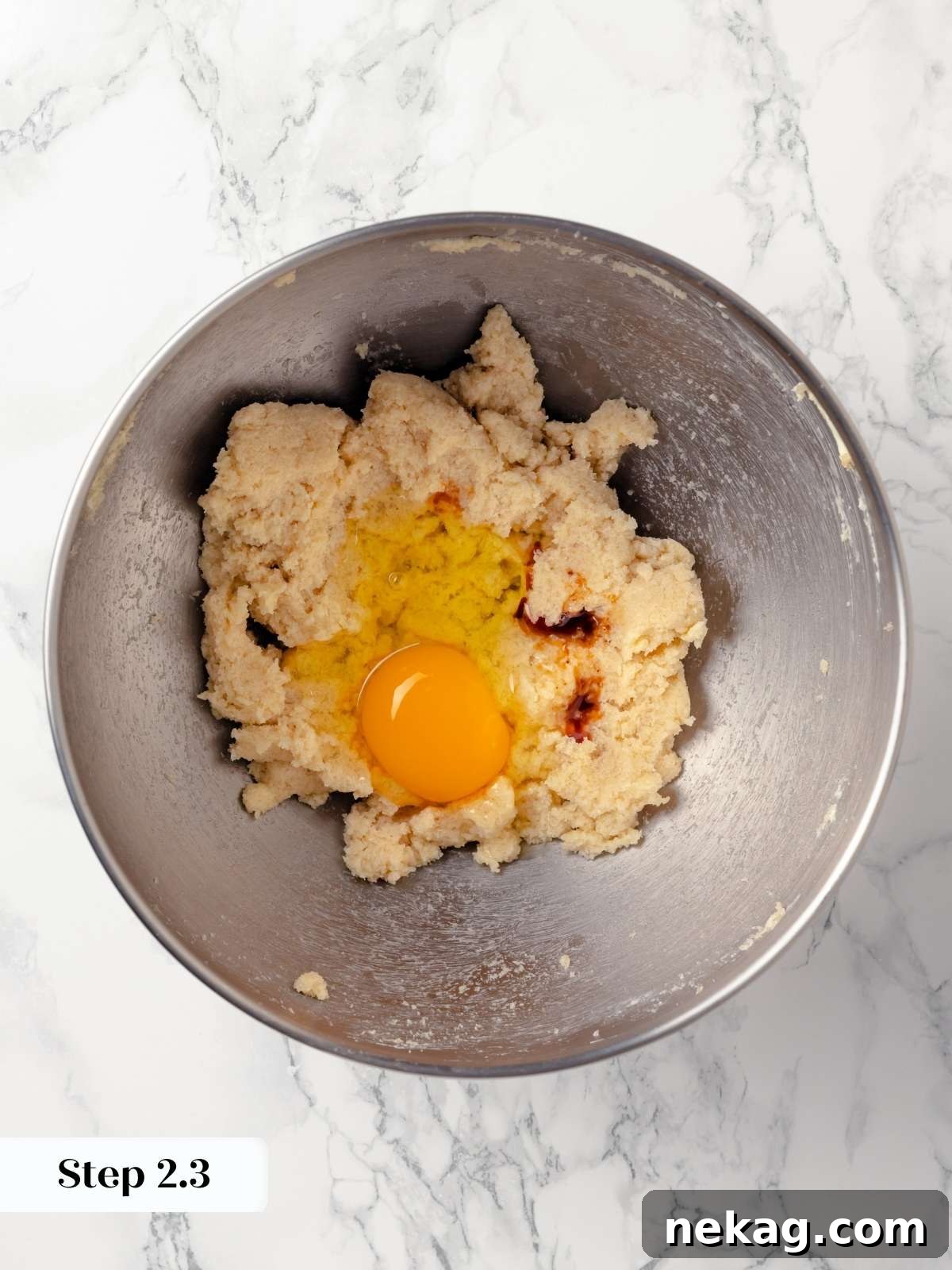 Partially mixed cookie dough in a bowl.