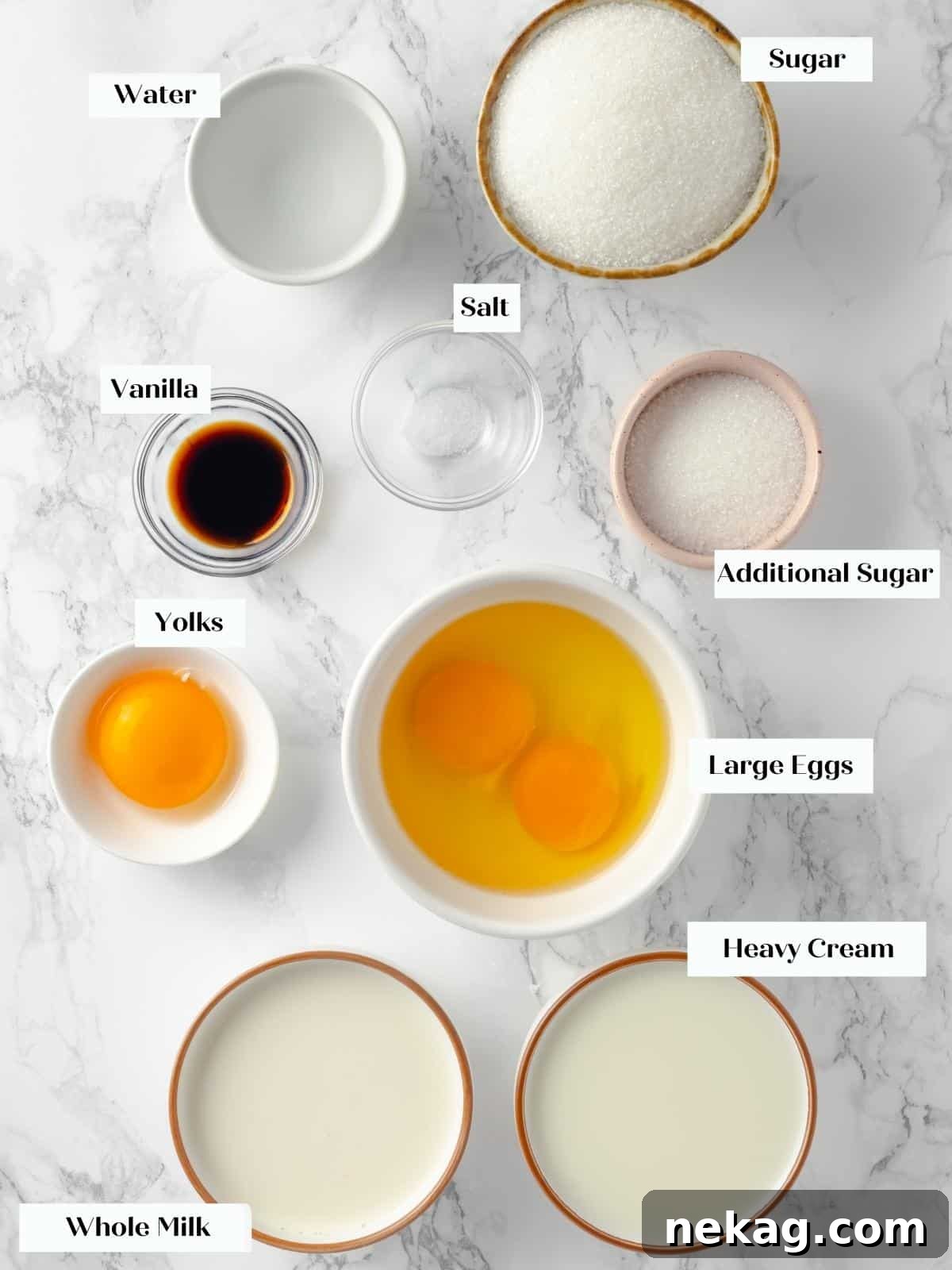 Silky Caramel Custard 3 Ingredients for creme caramel, including sugar, eggs, milk, and vanilla, arranged on a white countertop.